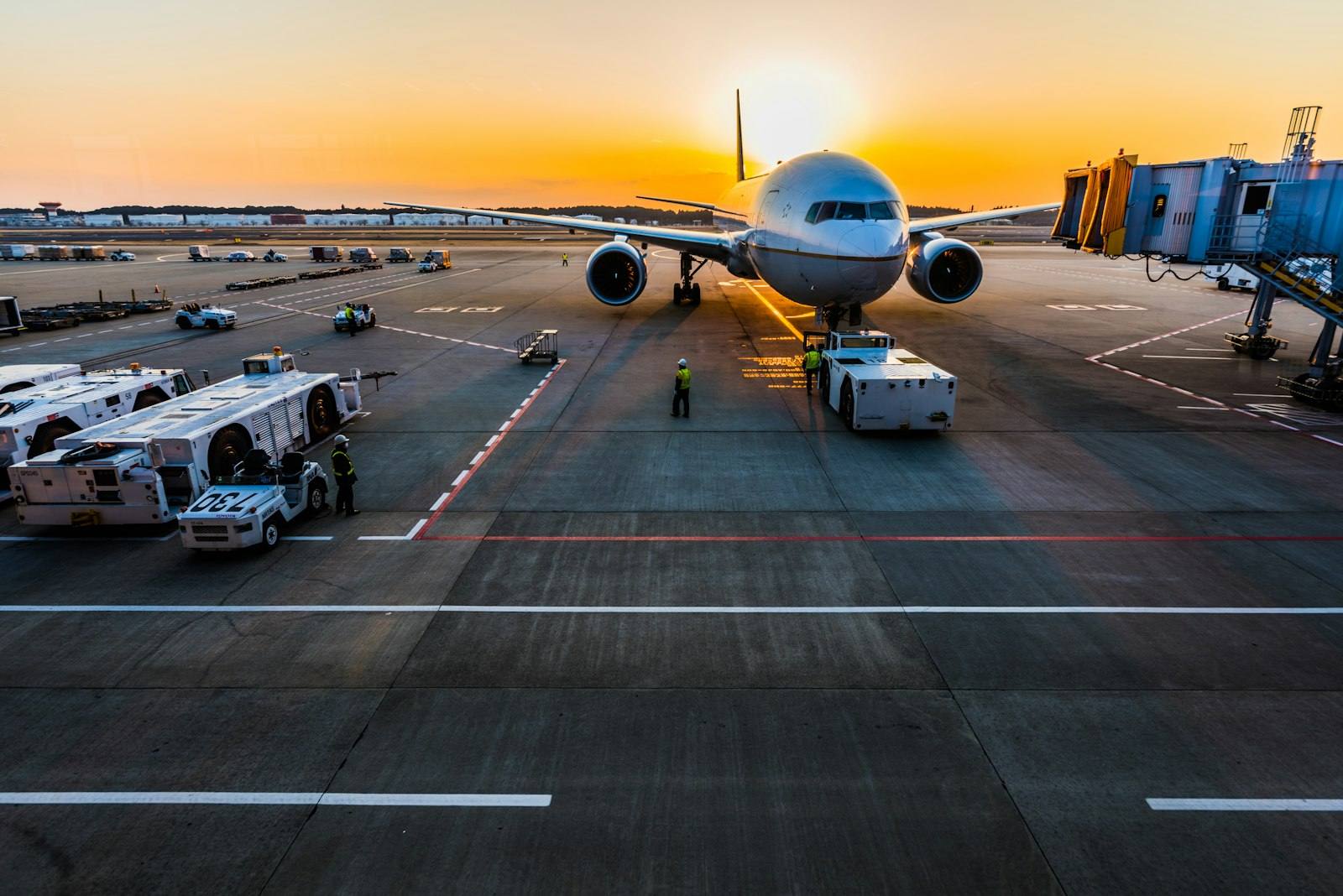 Cargo aircraft on tarmac at sunset
